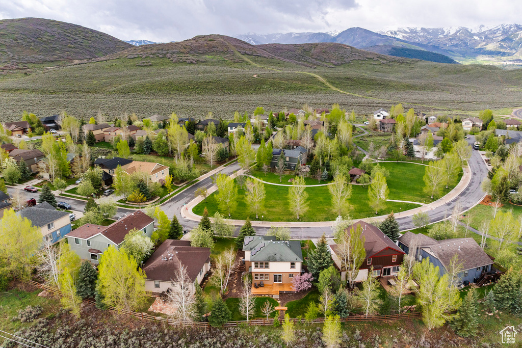 Aerial view of residential area featuring a mountainous background