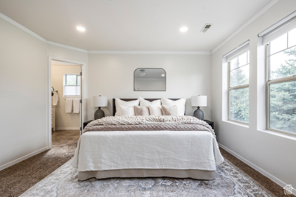 Bedroom featuring multiple windows, baseboards, ornamental molding, carpet flooring, and recessed lighting