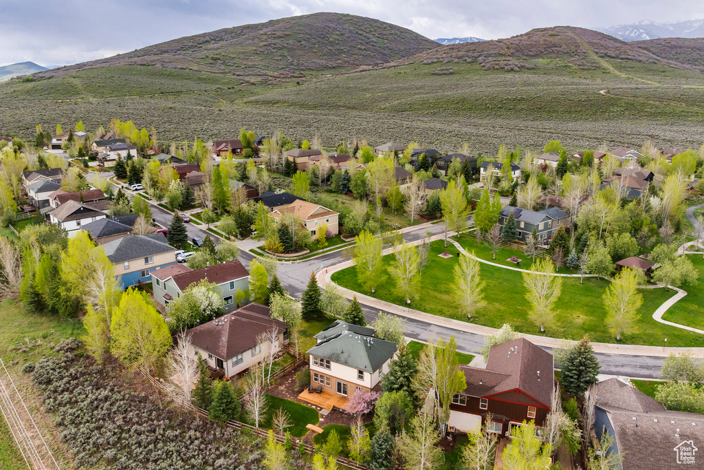 Aerial perspective of suburban area with a mountainous background