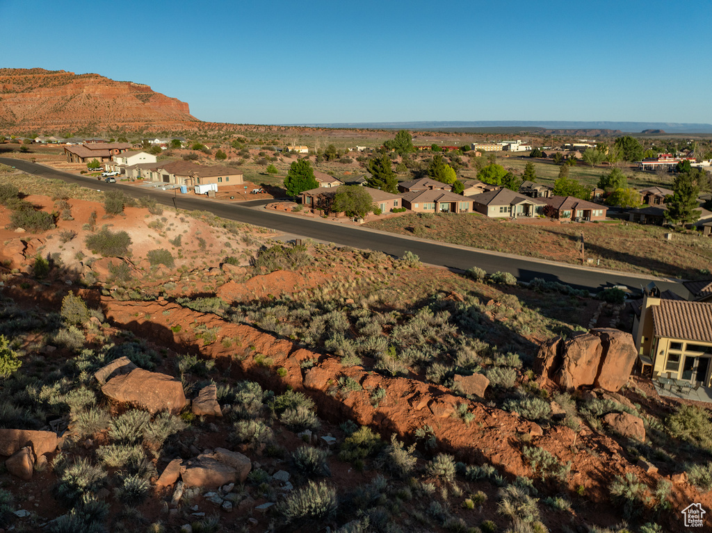 View of mountain backdrop featuring nearby suburban area