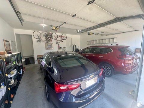 Garage featuring a garage door opener