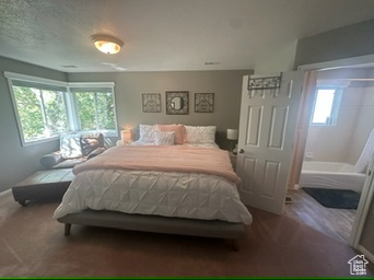 Carpeted bedroom featuring baseboards