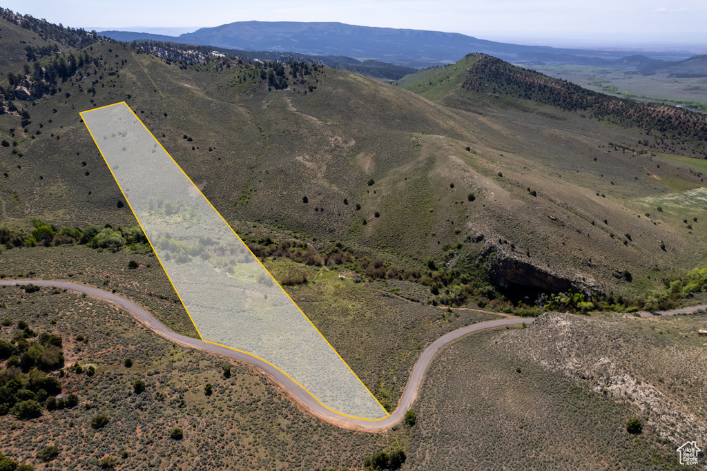 View of property location with a mountain backdrop and property parcel outlined