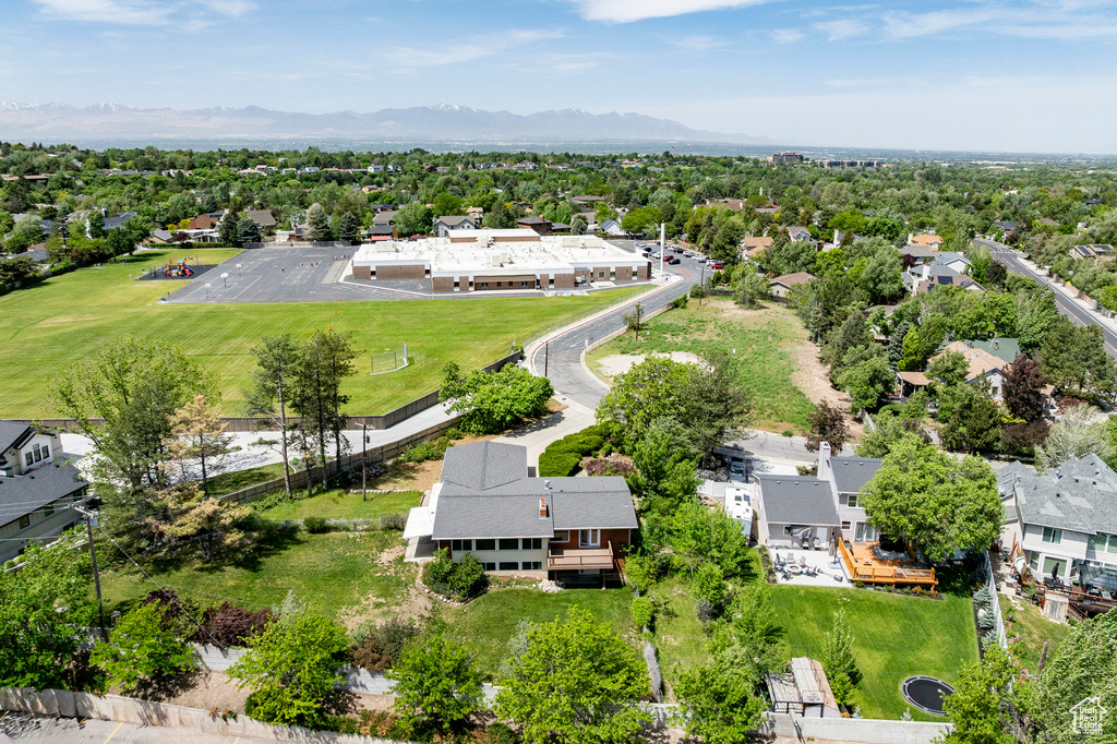 Aerial perspective of suburban area with a mountain backdrop