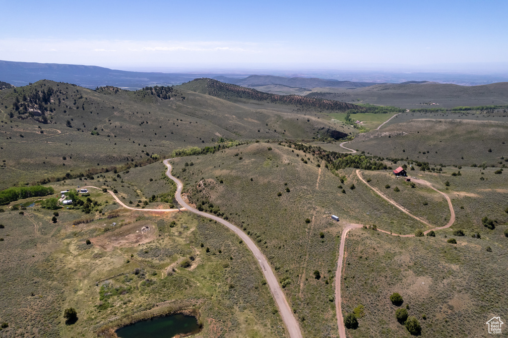 Aerial view of property and surrounding area with rural landscape and mountains
