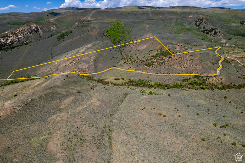 View of rural area featuring property boundaries highlighted and a mountainous background