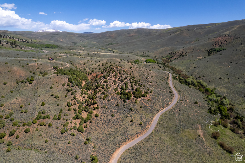 Aerial overview of property\'s location with mountains, a desert landscape, and rural landscape