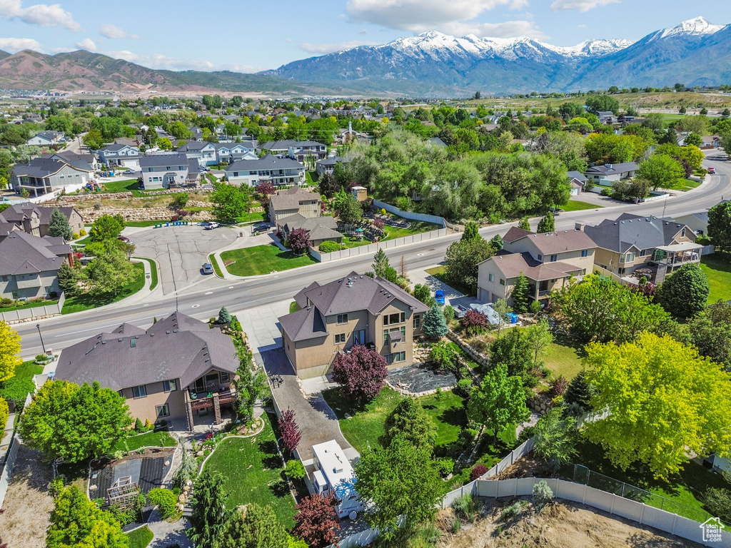 Aerial view of residential area featuring a mountain backdrop