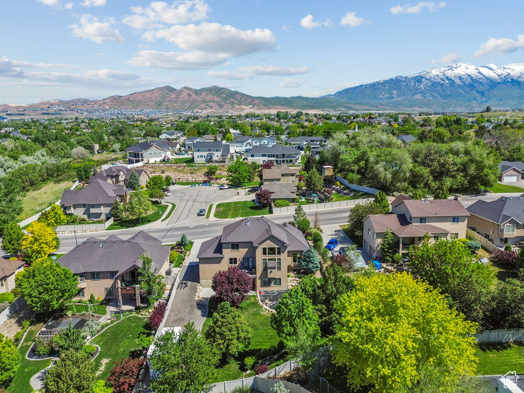 Aerial perspective of suburban area featuring a mountain backdrop