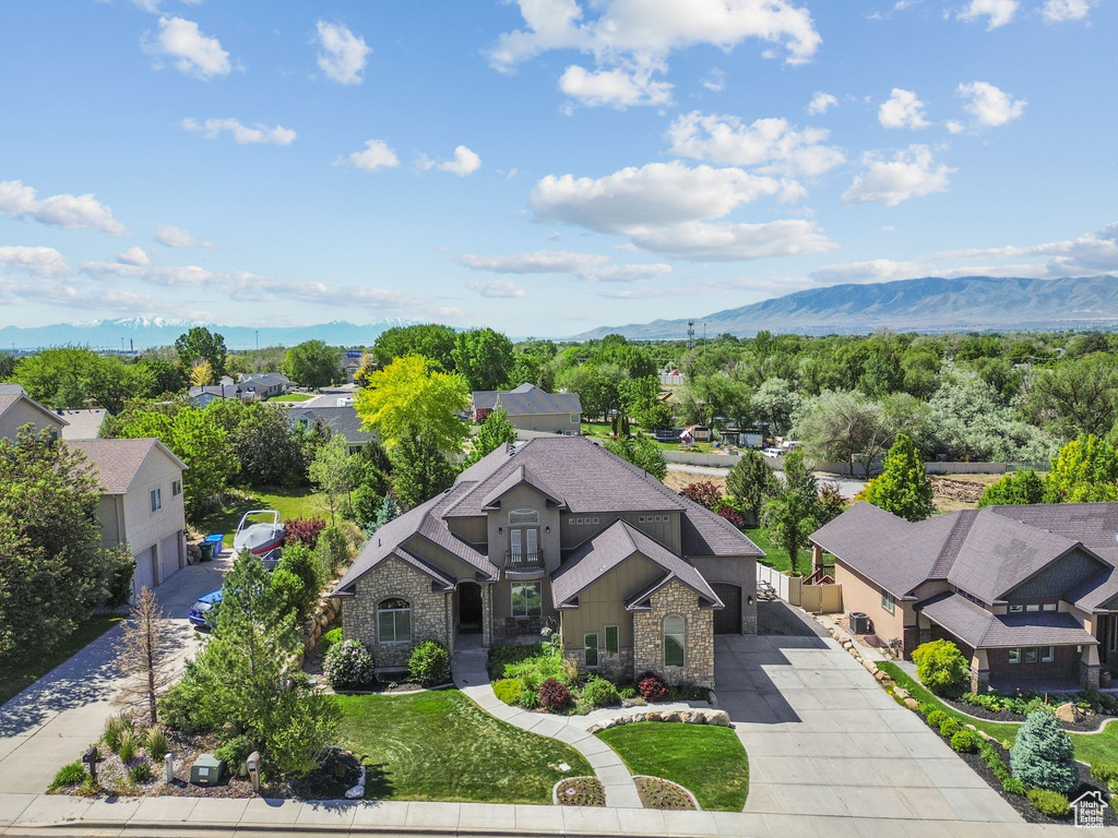 Aerial view of residential area featuring a mountain backdrop