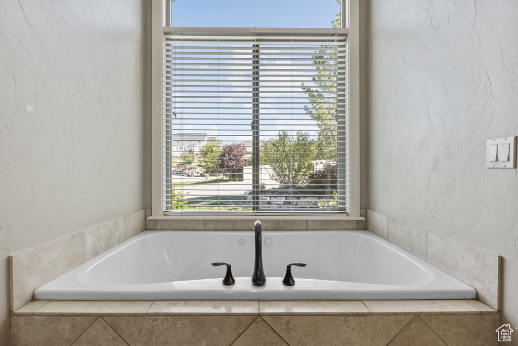 Full bathroom featuring a garden tub