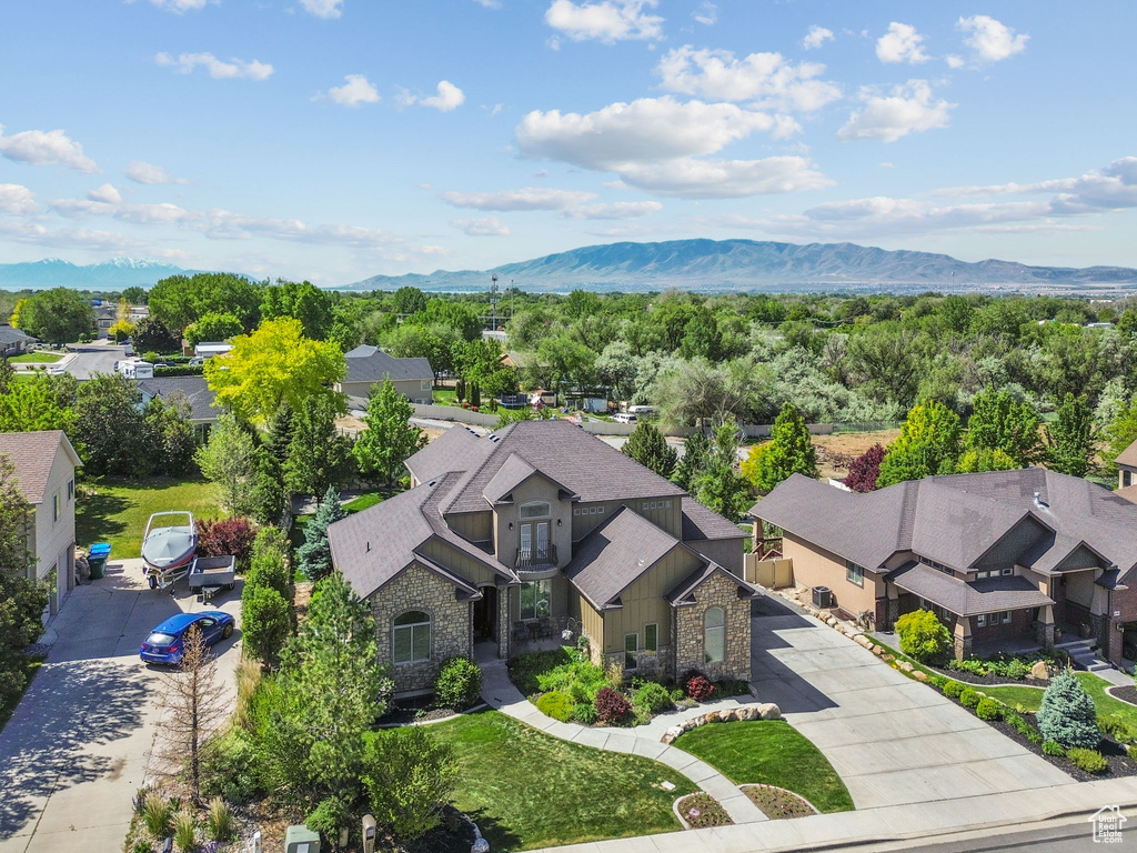 Aerial perspective of suburban area with a mountain backdrop