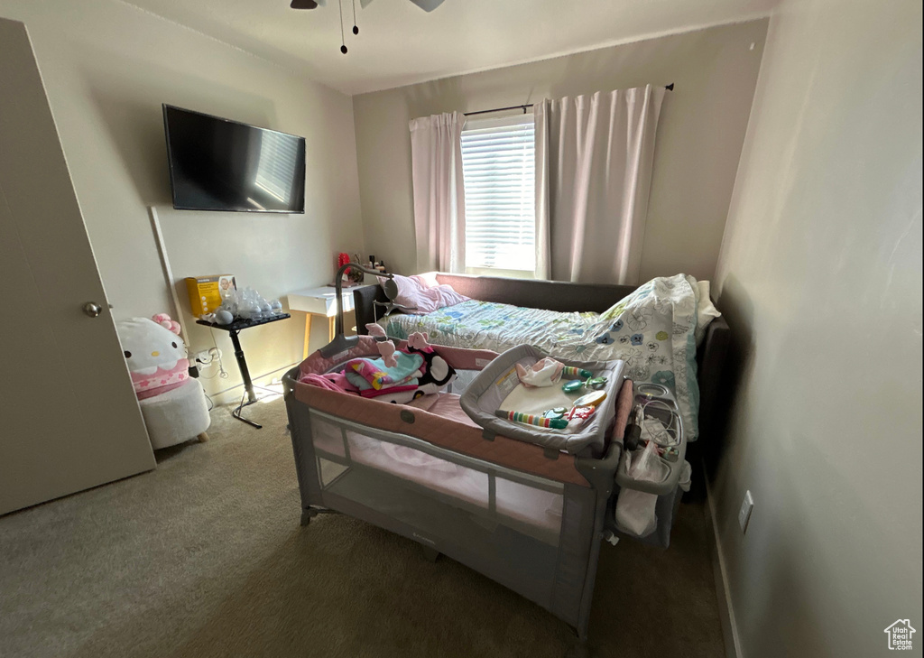 Bedroom with carpet flooring and ceiling fan