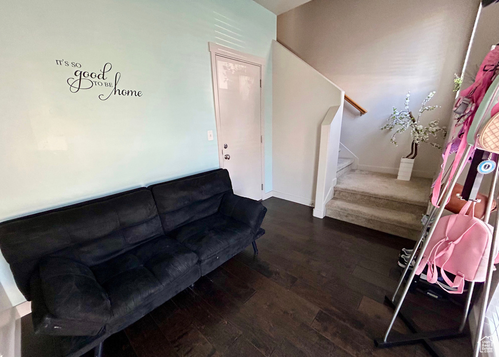 Living area featuring hardwood / wood-style flooring and stairway