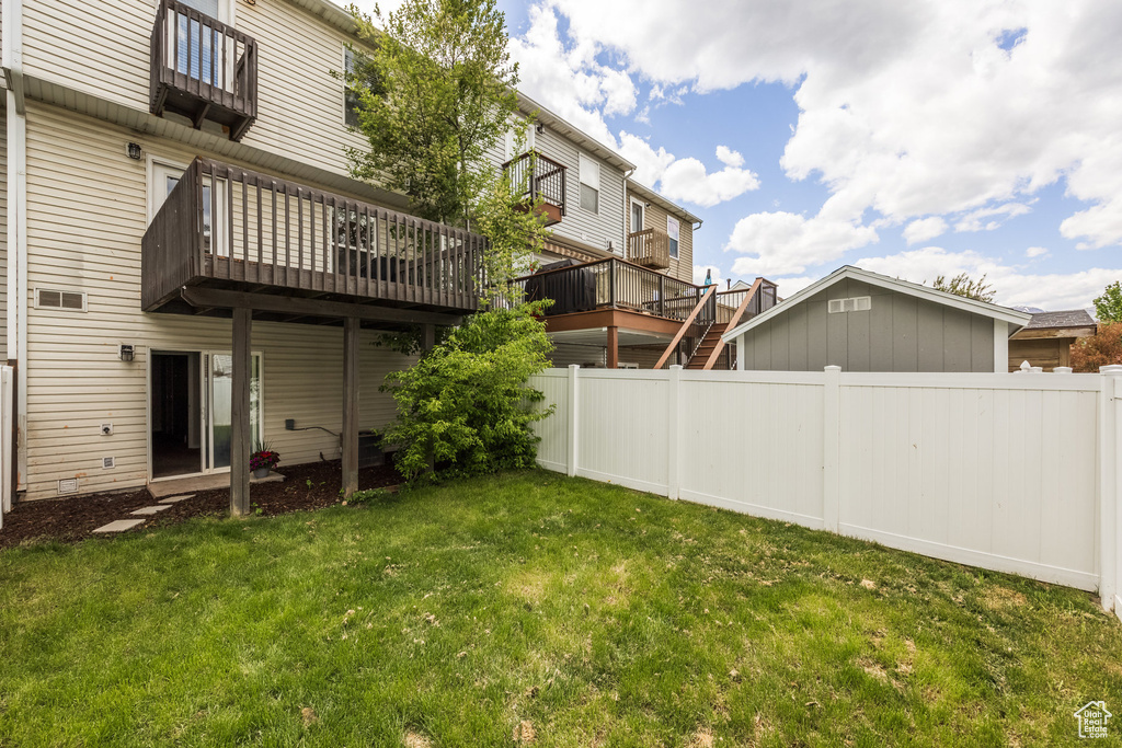 View of yard featuring a wooden deck
