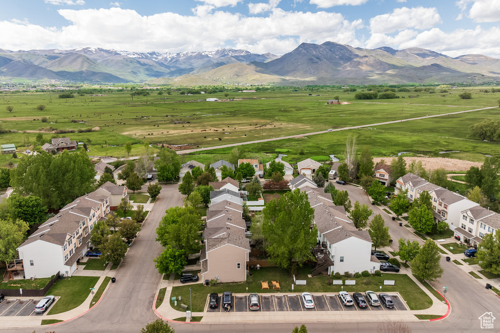 Aerial view of sparsely populated area with a mountainous background