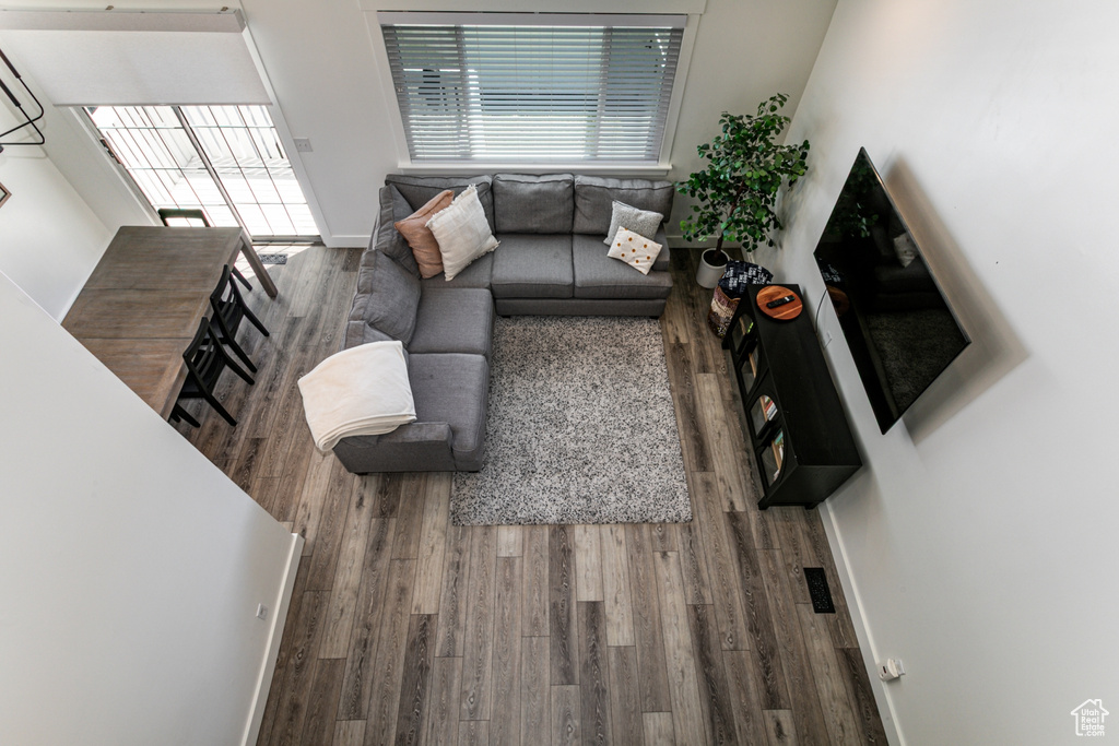 Living area with wood finished floors and baseboards