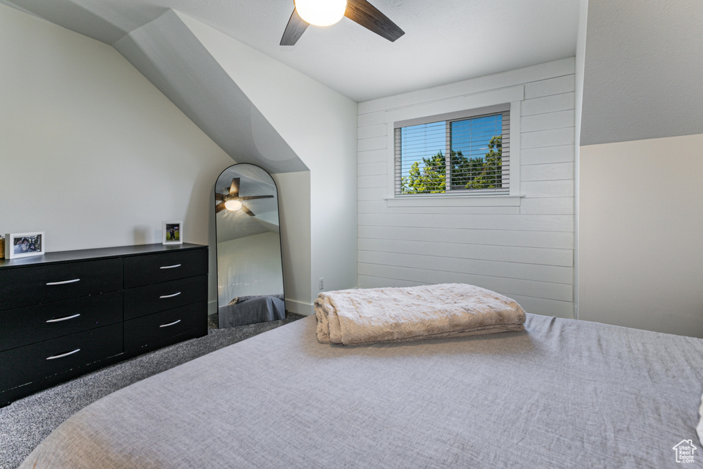 Bedroom featuring a ceiling fan and carpet flooring
