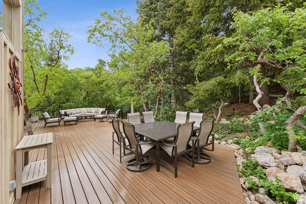 Wooden deck with outdoor lounge area and outdoor dining space