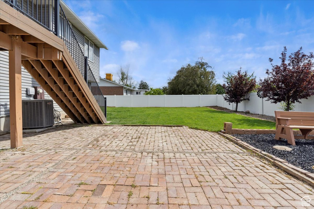 View of patio / terrace with cooling unit and stairway
