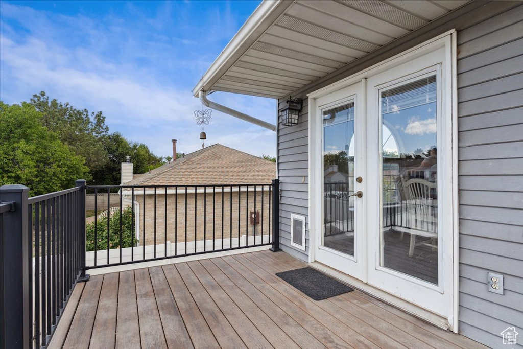 Wooden terrace featuring french doors