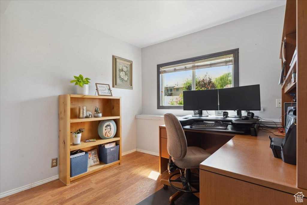 Office area featuring wood finished floors and baseboards