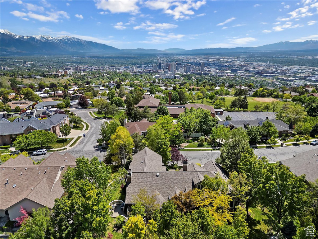 Aerial view of residential area featuring a mountain backdrop