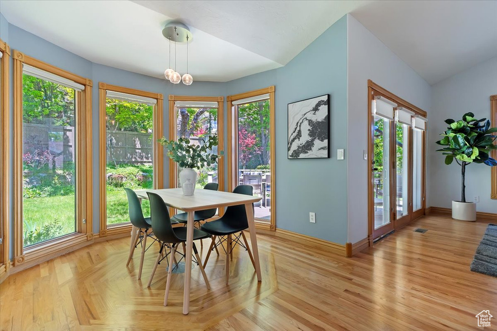 Dining room with baseboards and vaulted ceiling