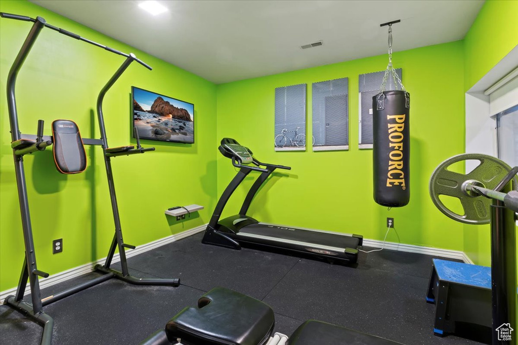 Workout room featuring baseboards