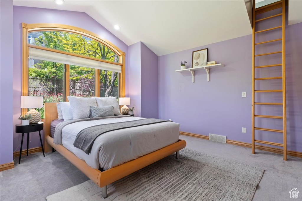 Bedroom featuring lofted ceiling, carpet floors, recessed lighting, and baseboards