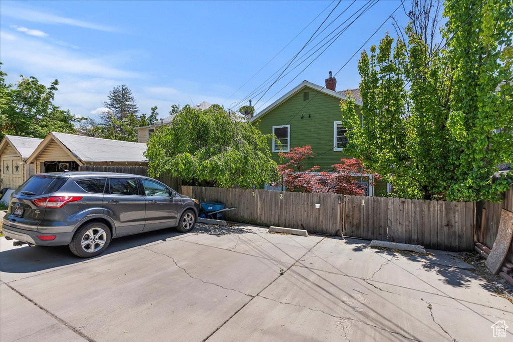 View of side of property with uncovered parking