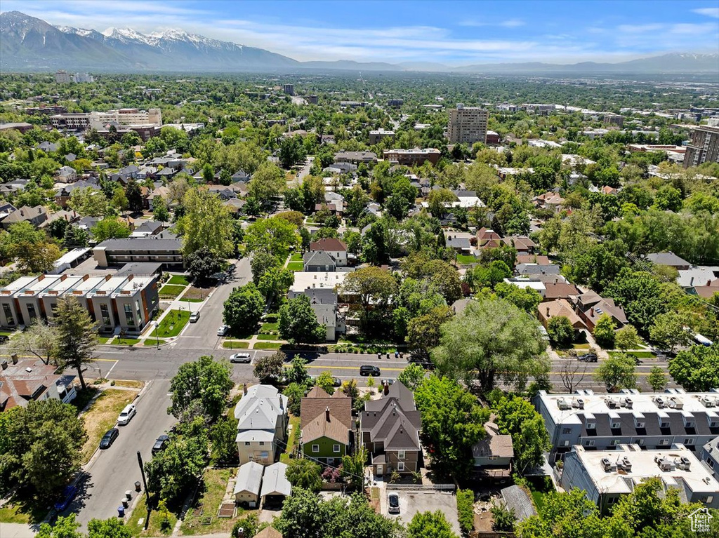 Aerial perspective of suburban area with a mountain backdrop