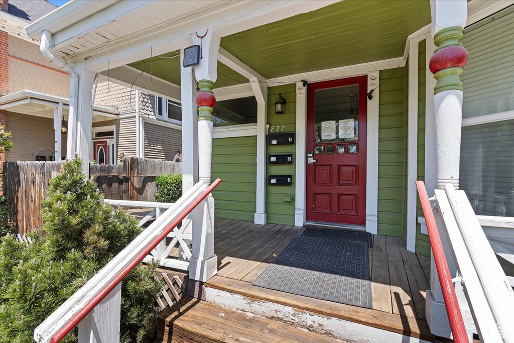 Doorway to property featuring a porch