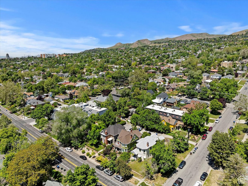 Aerial view of residential area featuring a mountain backdrop