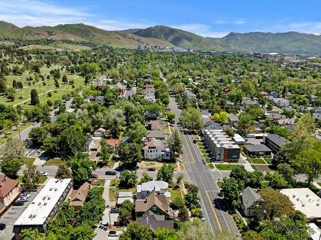 Aerial perspective of suburban area with a mountain backdrop