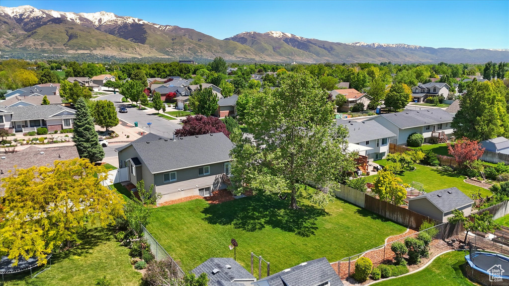 Aerial view of residential area featuring a mountainous background