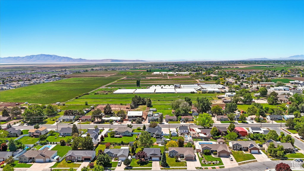 Aerial view of residential area with a mountainous background