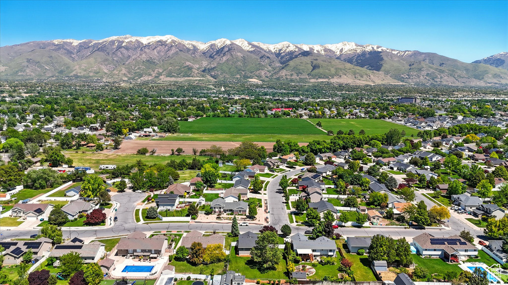 Aerial view of residential area featuring a mountainous background