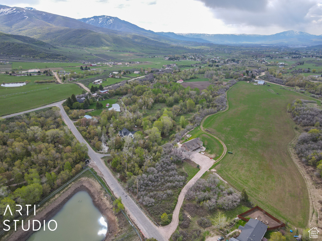 Aerial overview of property\'s location featuring a water and mountain view