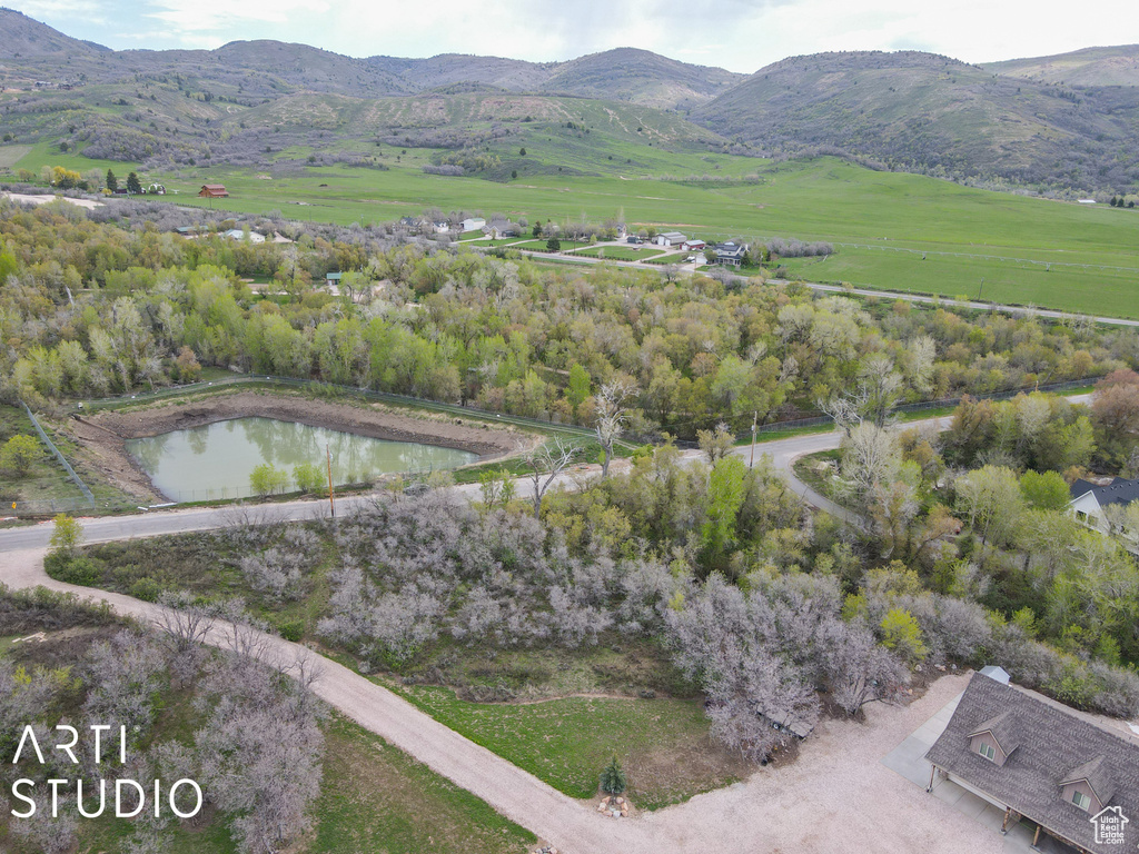 Aerial overview of property\'s location with a water and mountain view