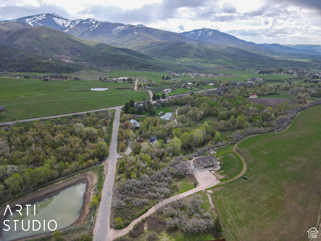 View of property location featuring a mountain backdrop and rural landscape