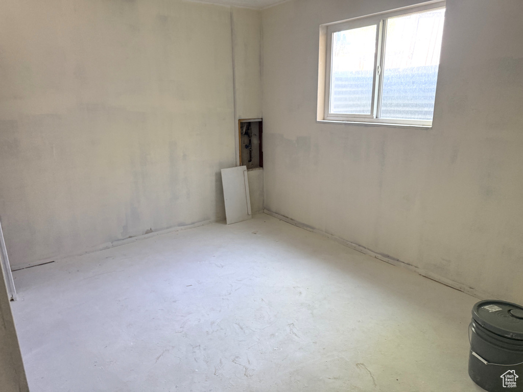 Unfurnished room featuring concrete floors