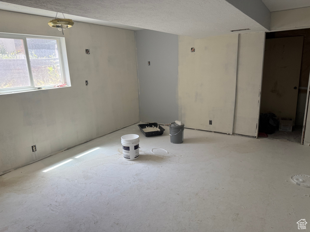 Empty room with a textured ceiling