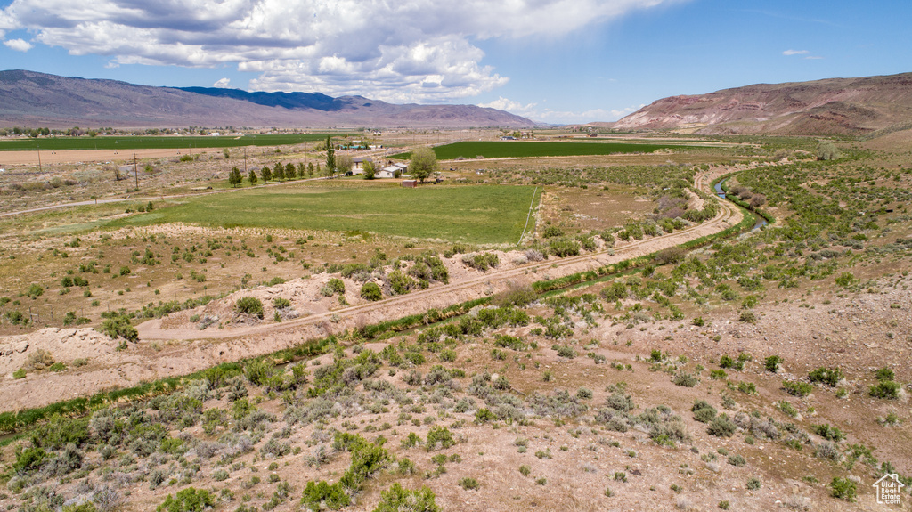 View of mountain backdrop featuring rural landscape