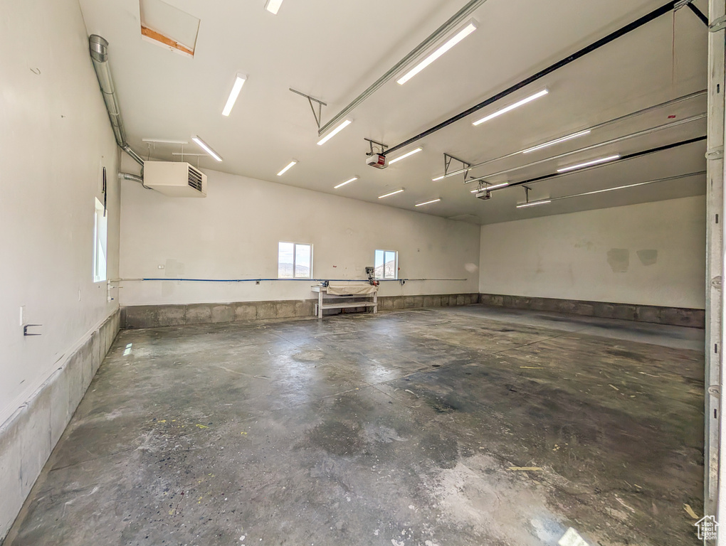 Garage featuring a garage door opener