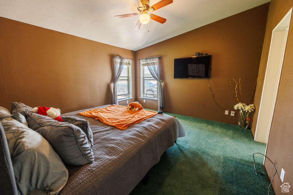 Bedroom with carpet flooring, lofted ceiling, and ceiling fan