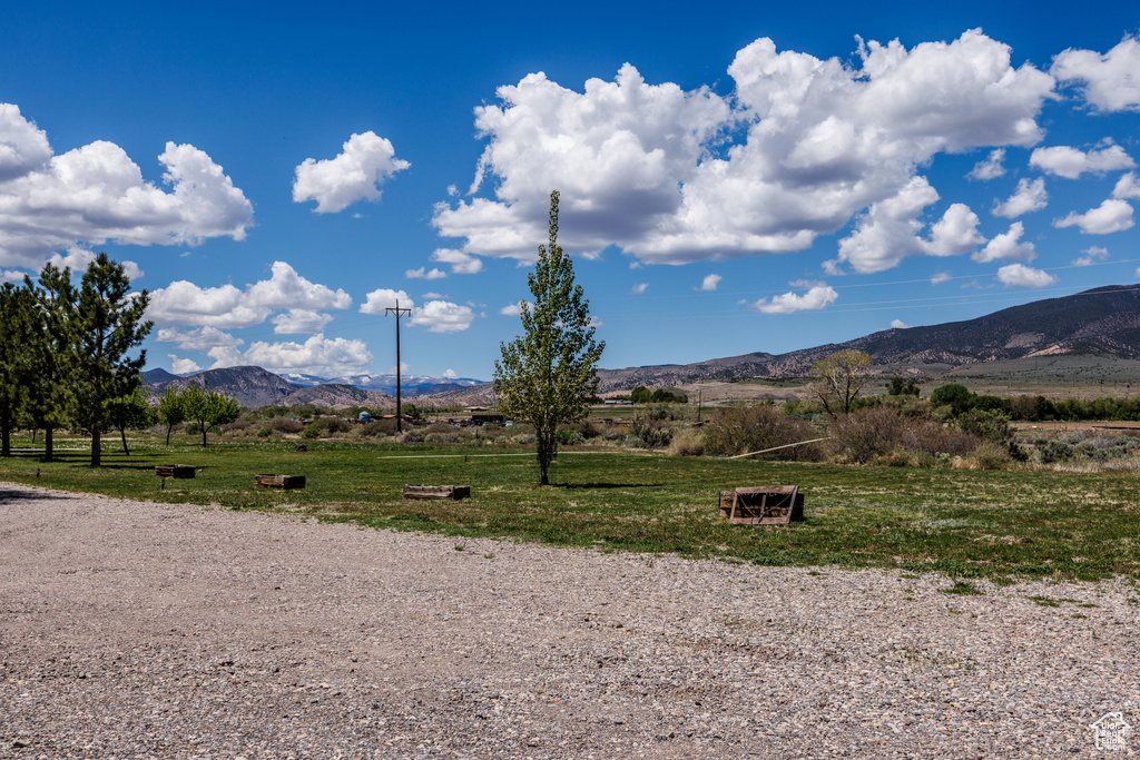 View of mountain background featuring rural landscape