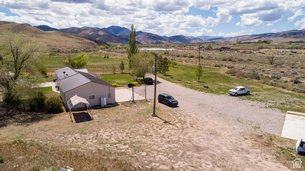 Overview of rural landscape featuring a mountain backdrop