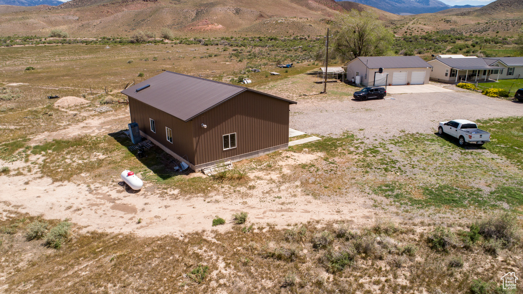 View from above of property featuring a mountainous background