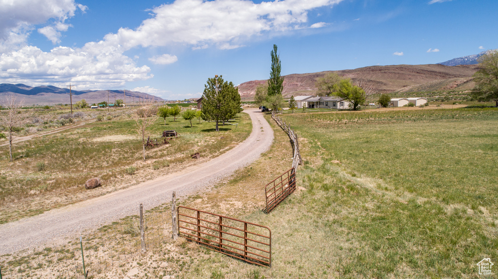 View of mountain background featuring rural landscape